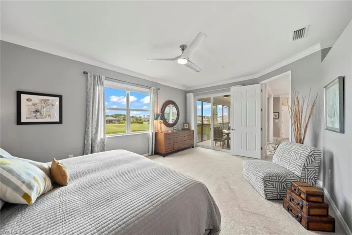 Bedroom featuring crown molding, light carpet, access to outside, and ceiling fan