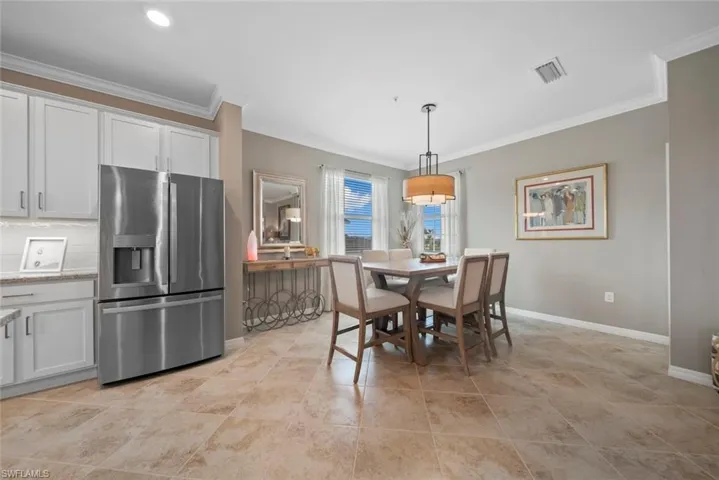 Dining area featuring ornamental molding