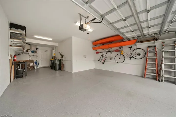 Garage featuring a garage door opener