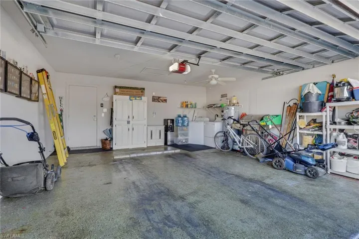 Garage featuring a ceiling fan and a garage door opener