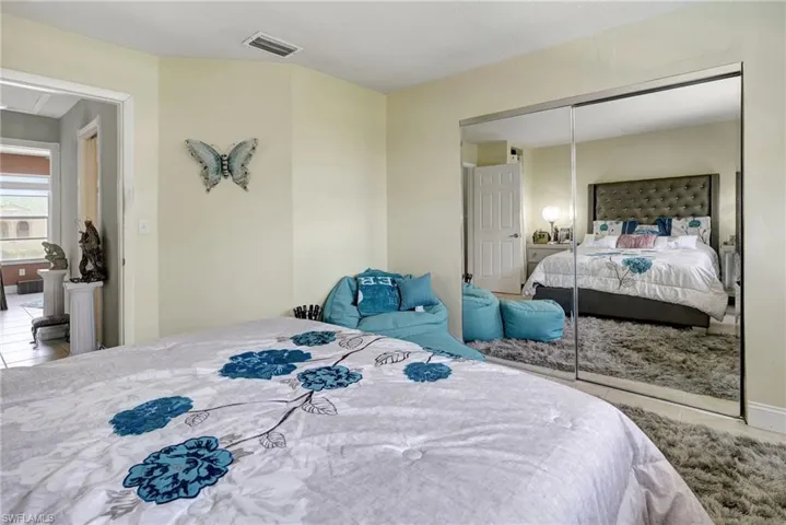Bedroom with a closet and tile patterned flooring