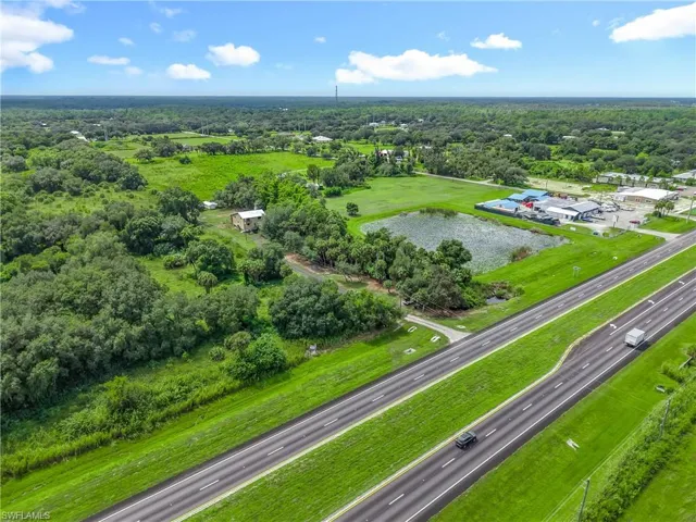 Aerial view of a major roadway and a large body of water