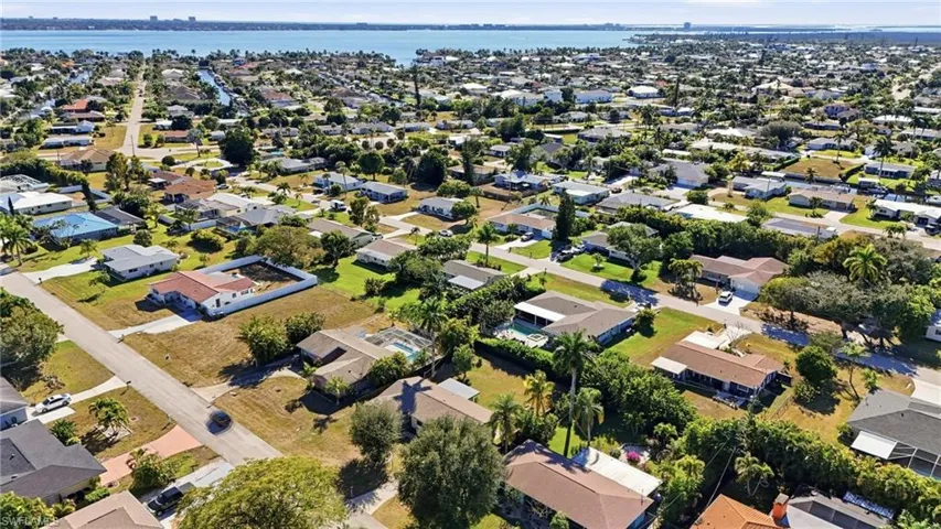 Aerial view of property's location featuring nearby suburban area