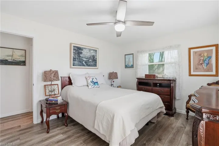 Bedroom featuring light wood-style flooring and a ceiling fan