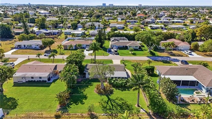 Aerial view of property's location featuring nearby suburban area