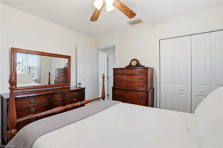 Bedroom with a closet and a ceiling fan