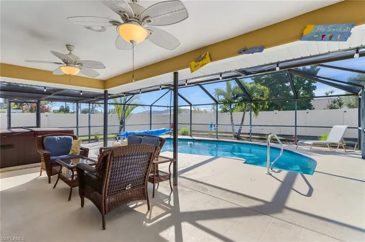 Large covered lanai facing the pool and spa area.
