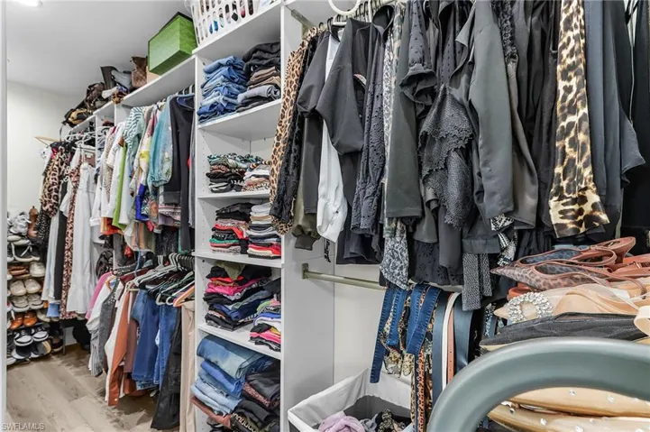 Master bedroom has a large walk-in closet with organizers.