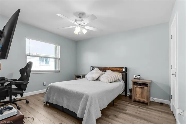 Rear guest bedroom doubles as a office work space.