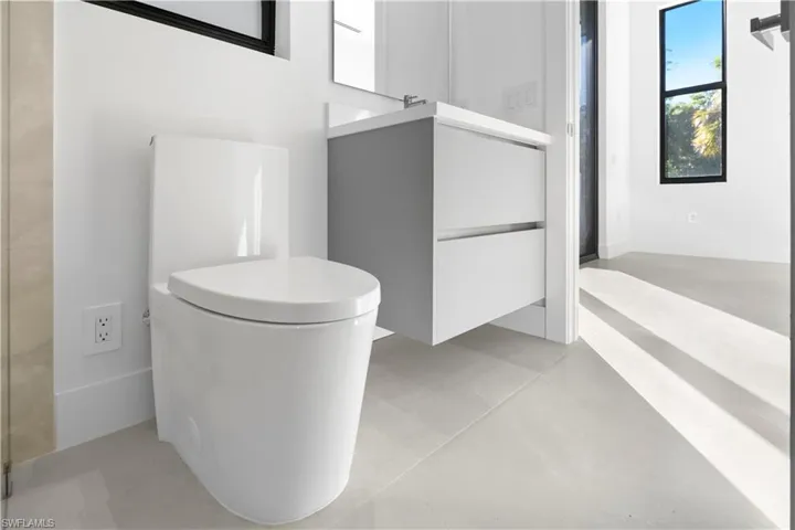 Full bathroom with vanity and toilet