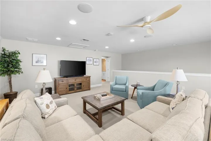 Uptairs Living area with carpet flooring, attic access, recessed lighting, and ceiling fan