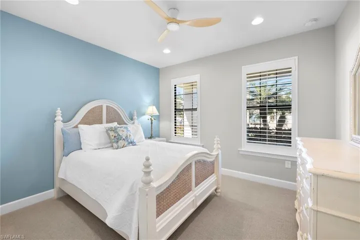 Guest Bedroom with a ceiling fan, light colored carpet, and recessed lighting