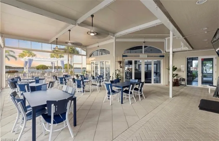 View of patio / terrace with outdoor dining area, french doors, and ceiling fan