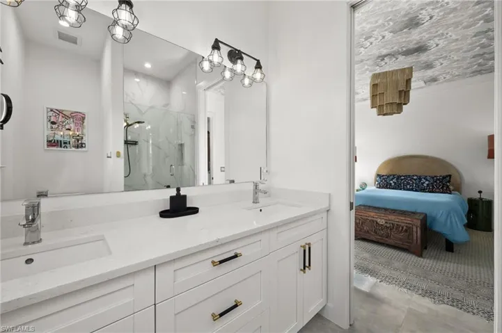 Bathroom with vanity and an enclosed shower