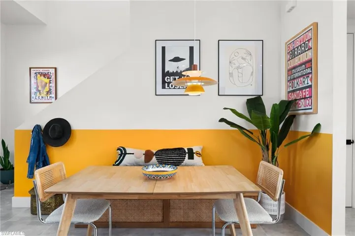 Dining space featuring concrete flooring
