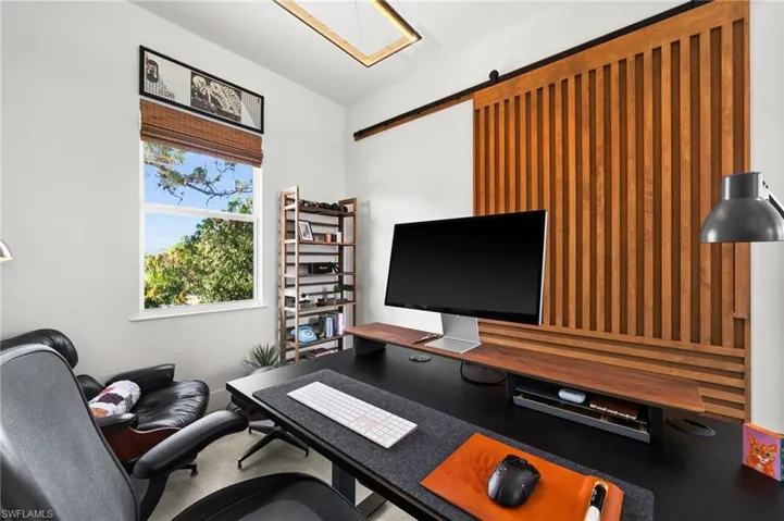 Office/Bedroom featuring a barn door