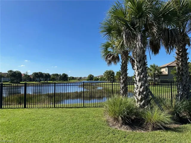 View of yard with a water view