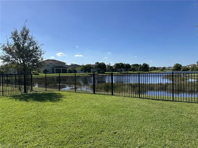 View of yard with a water view