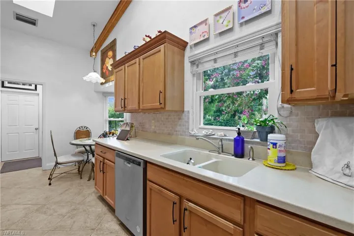 Kitchen with silky smooth Counters + Skylight upper left