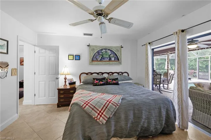 Primary Bedroom with killer Lanai Pool Views, do even want to get up?