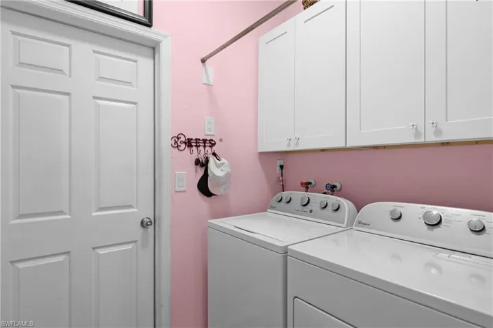 Laundry Room with added Cabinets + Door to Garage