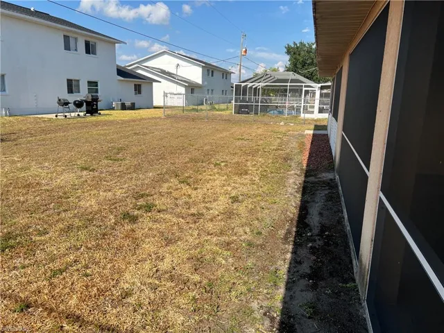 View of yard featuring a lanai
