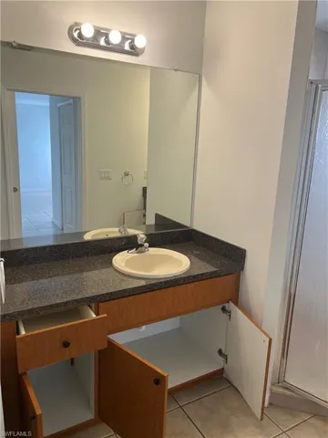 Bathroom with vanity and tile patterned floors