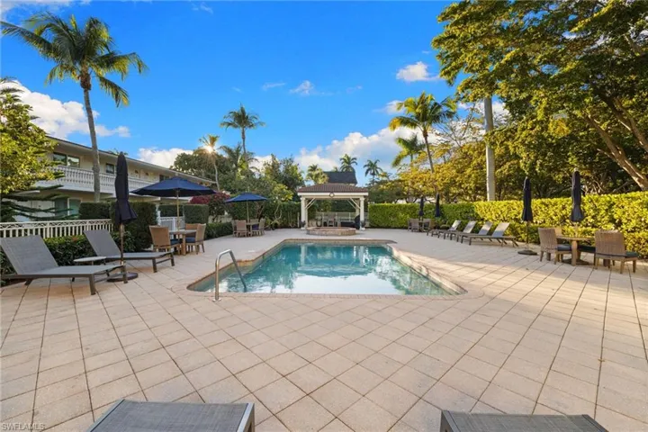 View of pool featuring a patio area, a gazebo, and outdoor dining space
