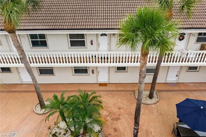 View of front of property featuring a tile roof
