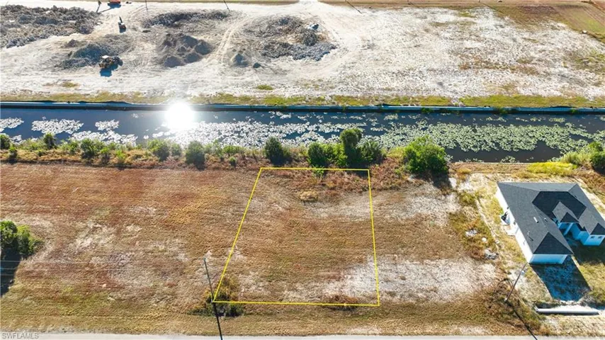 View of property location with property boundaries highlighted and a nearby body of water