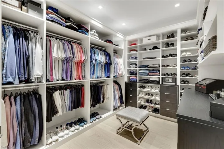 Walk in closet featuring wood finished floors