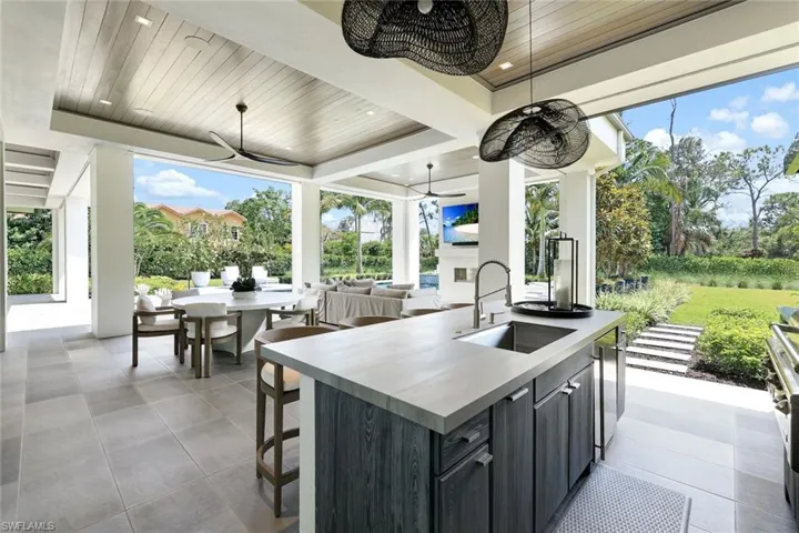 View of patio with a ceiling fan, outdoor dining space, and an outdoor hangout area