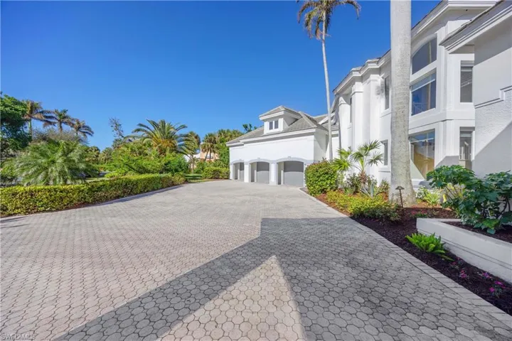 View of side of home featuring a garage