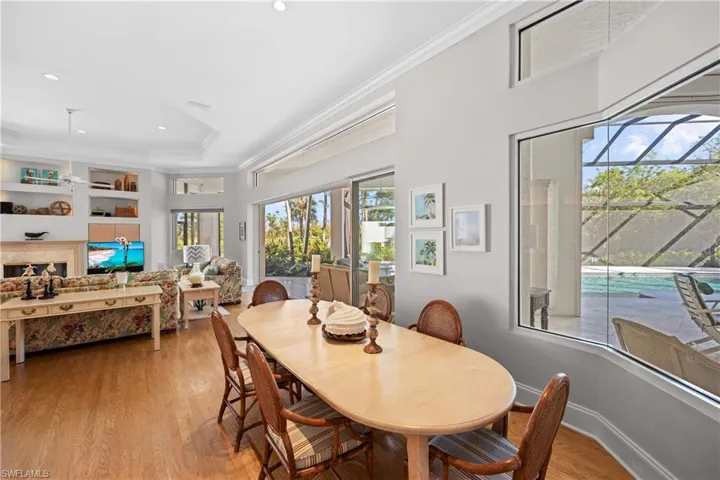 Dining area featuring light hardwood / wood-style floors and crown molding