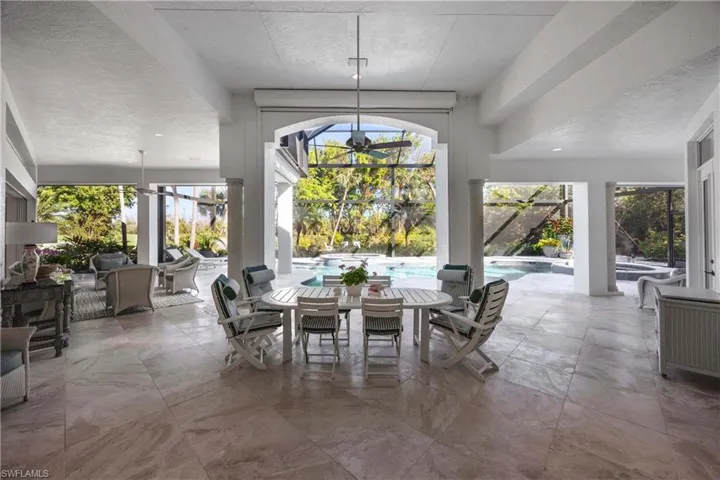 Dining space featuring a textured ceiling and a chandelier