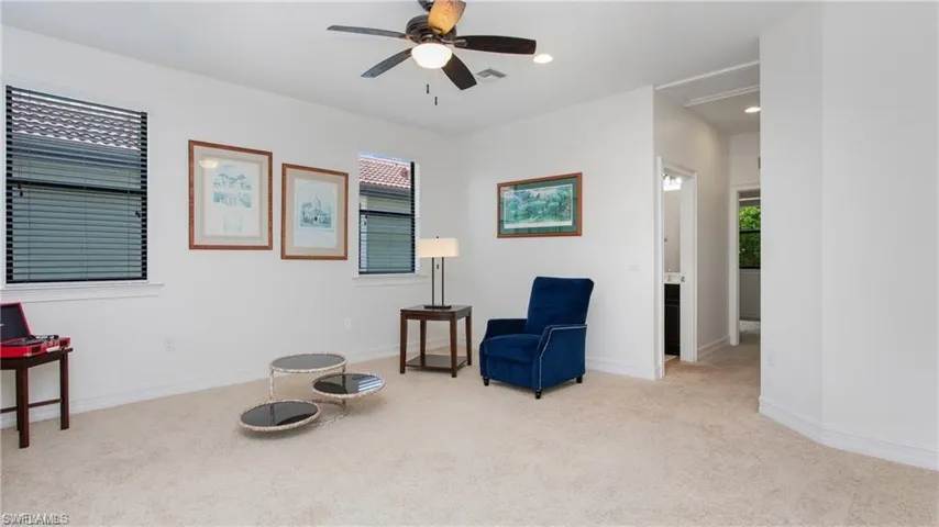 Sitting room with light colored carpet, healthy amount of natural light, a ceiling fan, and recessed lighting