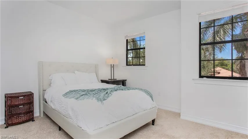 Bedroom with carpet floors and baseboards