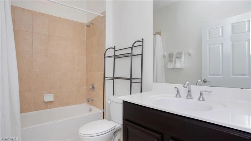 Bathroom featuring vanity and shower / bath combo