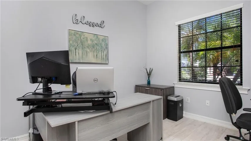 Office featuring baseboards and wood finished floors