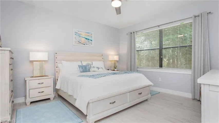 Bedroom featuring light wood finished floors and a ceiling fan
