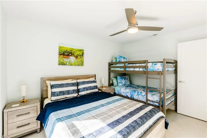 Bedroom featuring Queen size bed, bunk with 2 twin beds and 2 nightstands