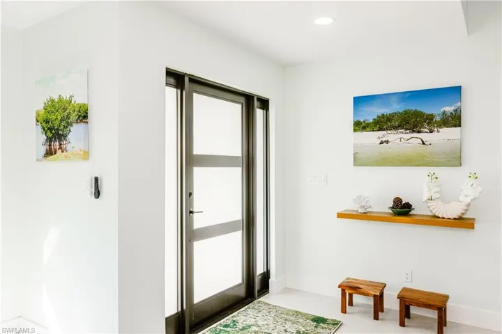 Doorway featuring recessed lighting and tile patterned floors