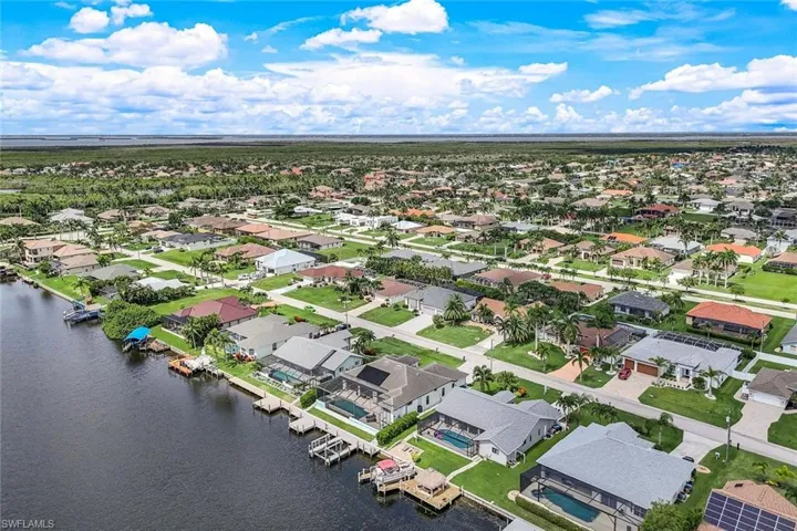 Aerial view of residential area with a large body of water