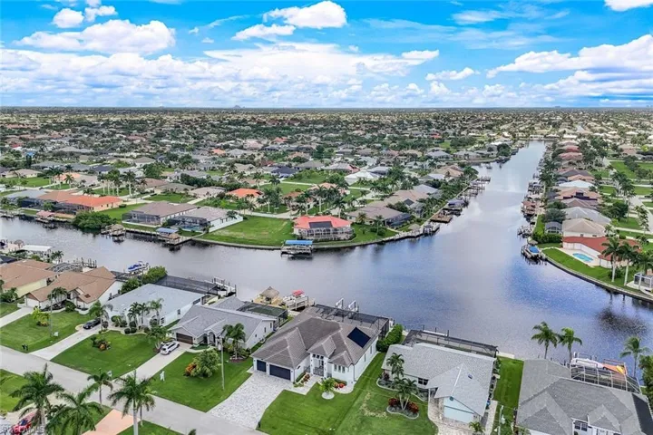 Aerial perspective of suburban area with a nearby body of water