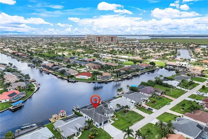 Aerial view of residential area with a large body of water