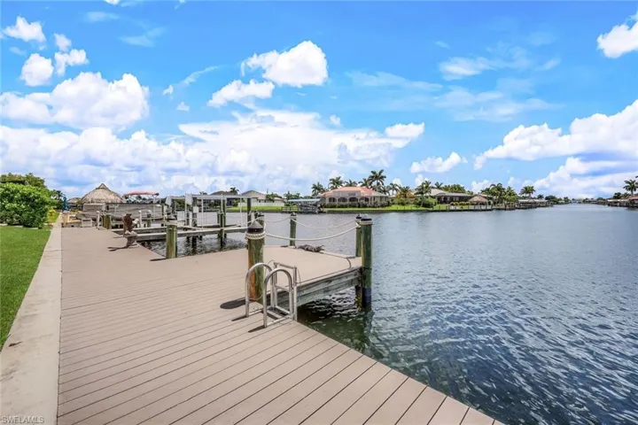 Dock area featuring a water view and boat lift