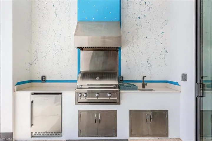 View of patio / terrace with a sink and an outdoor kitchen