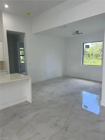 Spare room featuring a wealth of natural light
