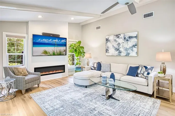 Den with electric fire place