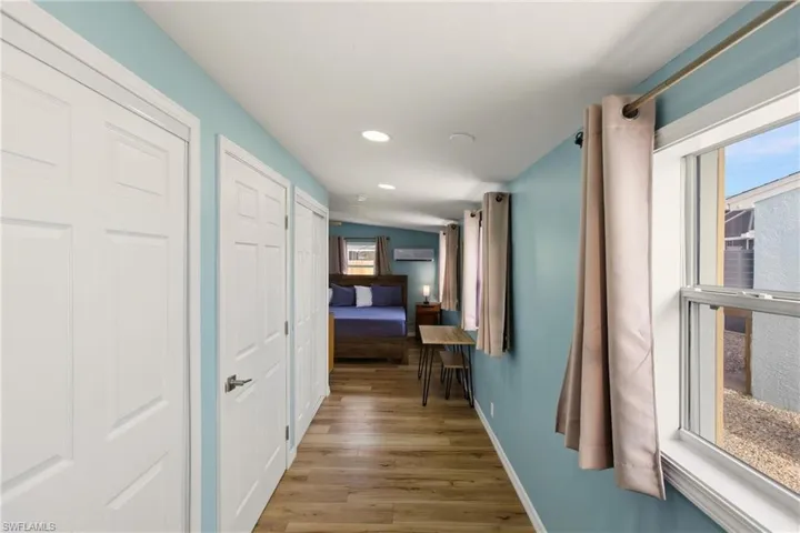 Hall featuring recessed lighting and light wood-style flooring